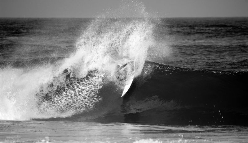 Damian Hobgood, burning water. Photo: <a href=\"https://www.paulcretinonphotography.com/\">Paul Crétinon</a>